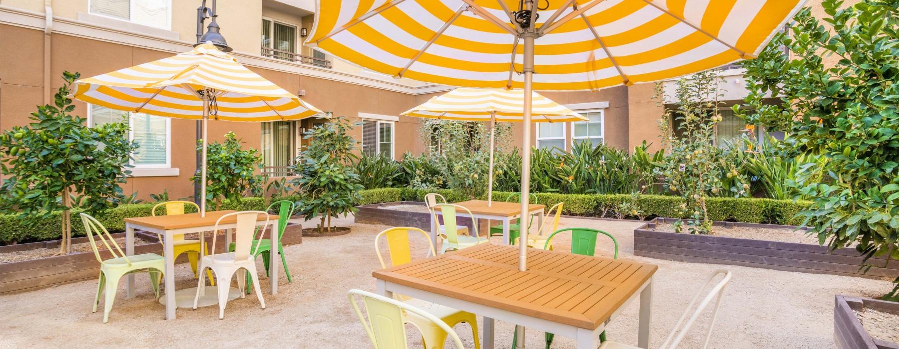 a group of tables and chairs outside