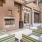 an outdoor  room with a fireplace