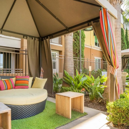 Access to resident-only features a patio with a bench and a table and chairs