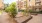 a courtyard with trees and buildings