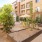 a courtyard with trees and buildings