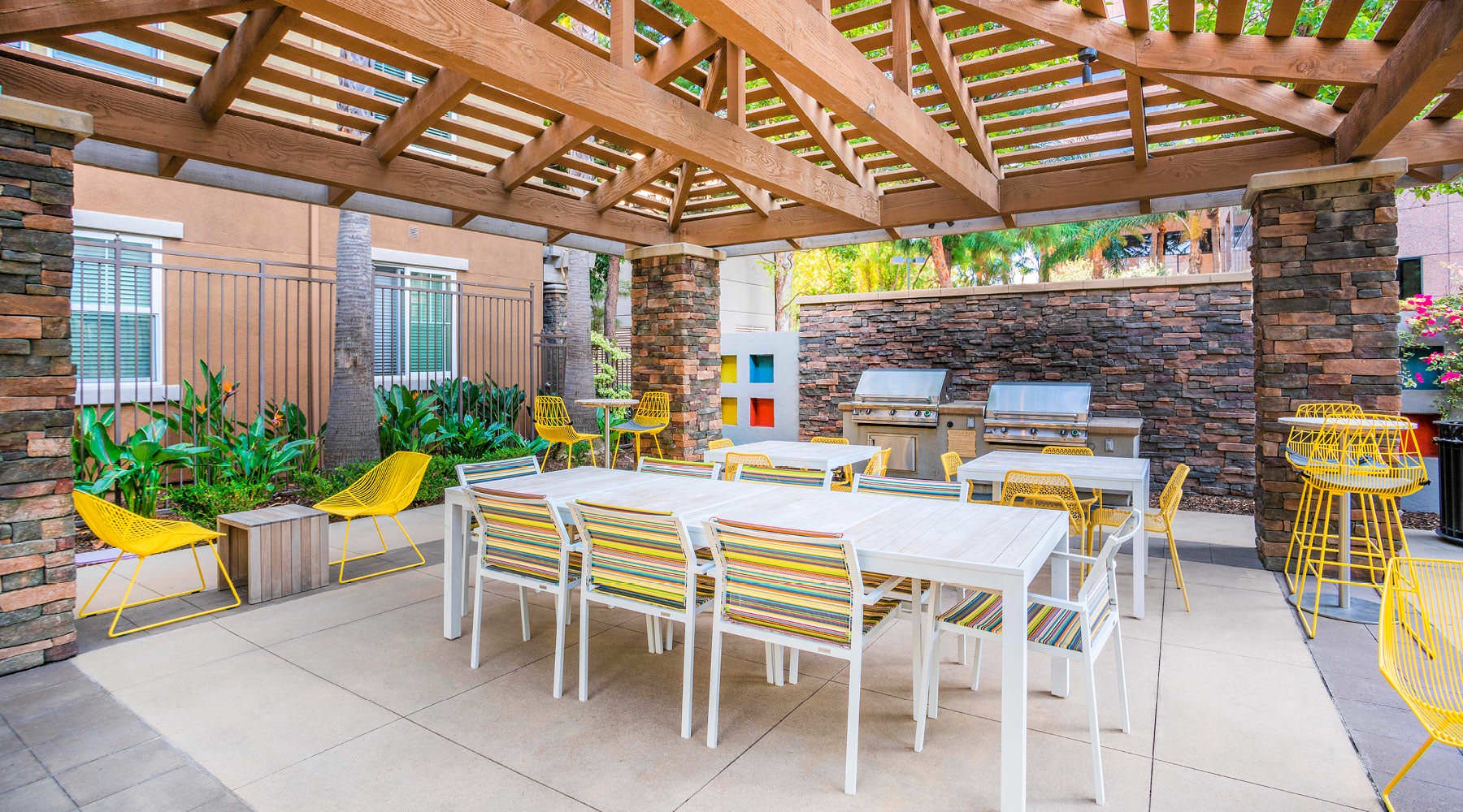 Take advantage of all Main Street Village has to offer a patio with tables and chairs