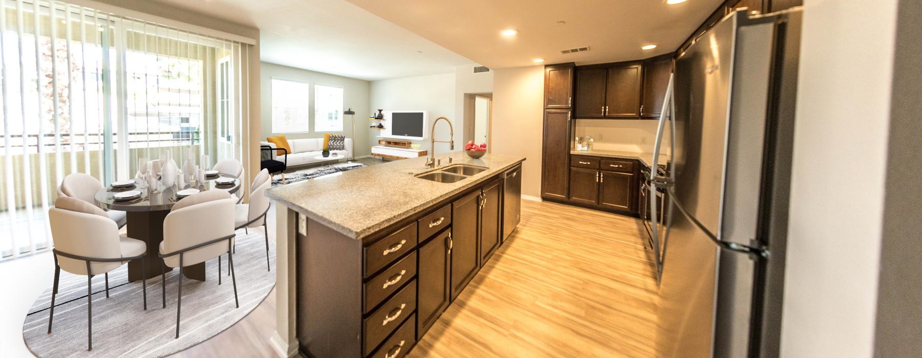 a kitchen with a bar and dining table